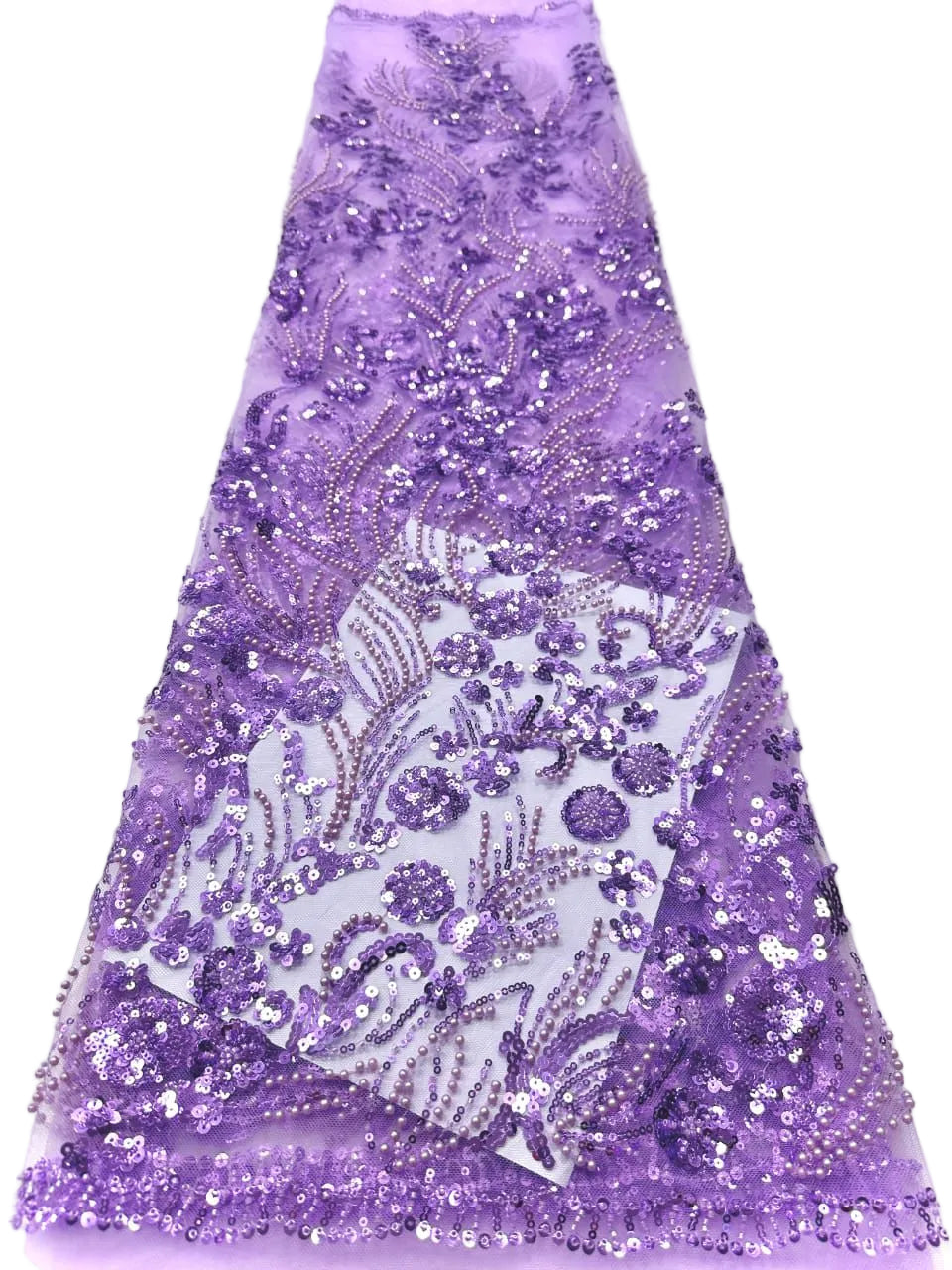 Purple sequin fabric with intricate patterns on a white background